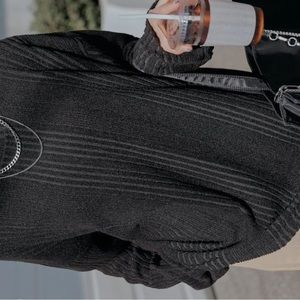 Dazy ribbed knit drop shoulder tee in the color black.